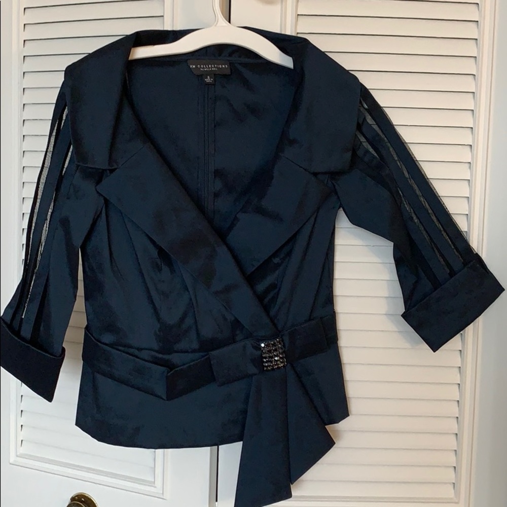 KM collection is blouse. Size 8.